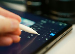 Editing a photo with a stylus on a tablet