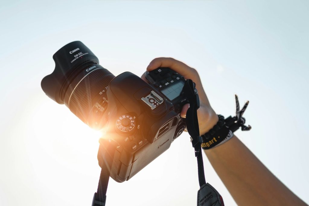 Photographer holding a mirrorless camera