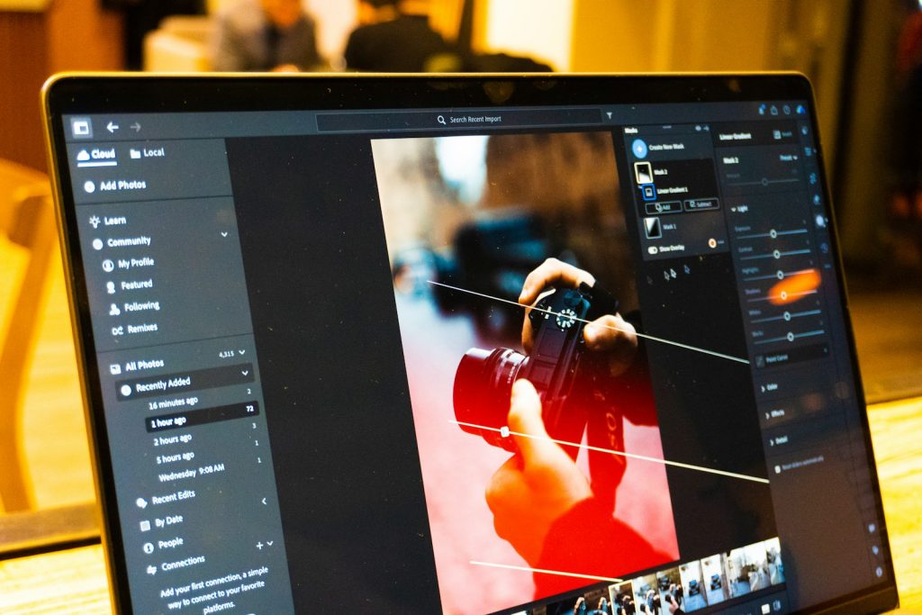Photo editing software shown on a laptop screen