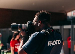 Photographer taking a portrait with a DSLR camera